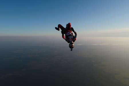 Skydiving. Freefly jump. A girl is having fun in the sky.の写真素材