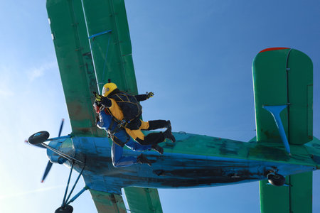 Skydiving. Tandem jump. Two guys are in the sky.