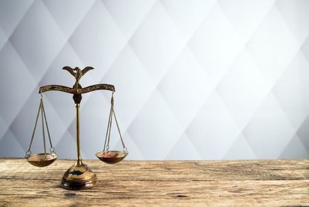Law scales on table. Symbol of justiceの写真素材