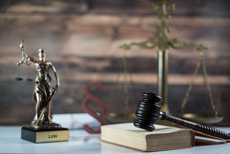 Law symbols. Lawyer theme. Judge wooden gavel.