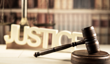 Law concept. Burden of proof. Gavel in court library.の写真素材