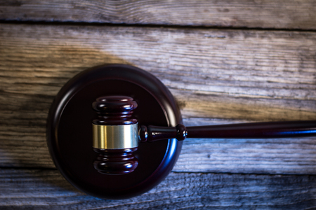 Law concept. Burden of proof. Gavel in court library.の写真素材
