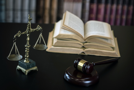 Law Concept. Judges Gavel And Scale Of Justice. wooden desk, books