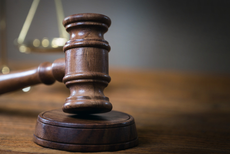 Symbols of the law on a rustic deskの写真素材