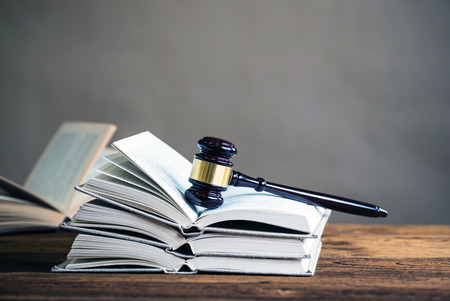 Symbols of the law on a rustic deskの写真素材