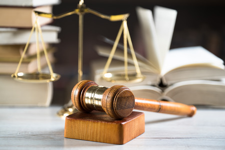 Symbols of the law on a rustic deskの写真素材