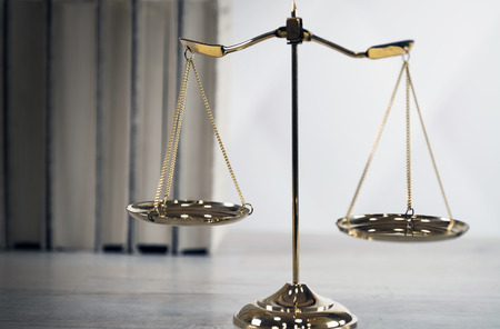 Symbols of the law on a rustic deskの写真素材