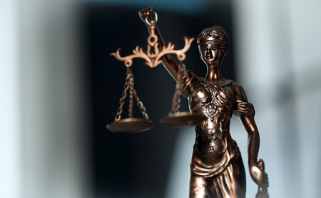 Symbols of the law on a rustic deskの写真素材