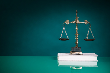 Symbols of the law on a rustic deskの写真素材