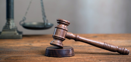 Law theme, mallet of the judge, wooden desk, booksの写真素材