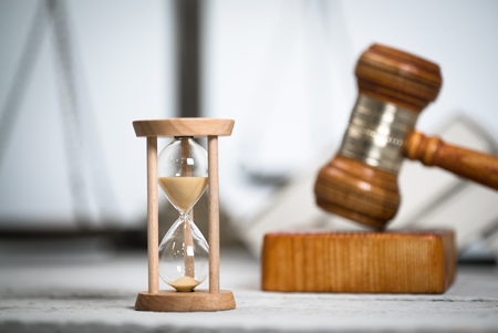 Law theme, mallet of the judge, wooden desk, booksの写真素材