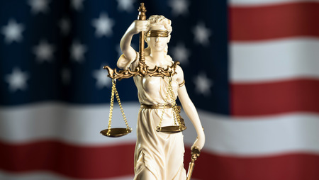 Burden of proof - Moodily lit legal concept with Scales of justiceの写真素材