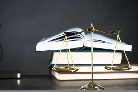 Gavel and legal book on wooden tableの写真素材