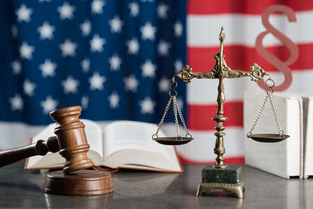 Gavel and legal book on wooden tableの写真素材