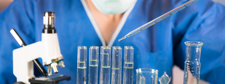 Science laboratory research and development concept. microscope with test tubesの写真素材