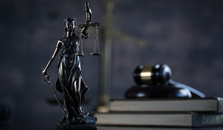 Law and Justice concept. Brown wooden background