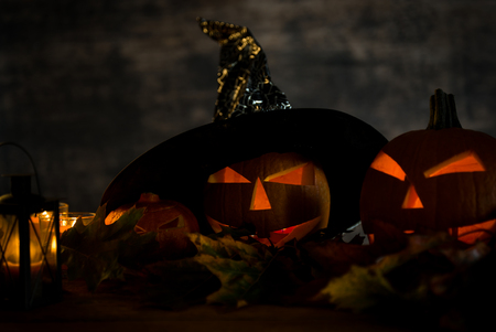 Halloween pumpkin head jack lantern with burning candlesの写真素材