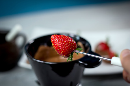 Chocolate fondue with fresh strawberriesの写真素材