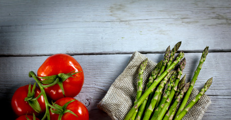 Bundle of fresh raw green asparagusの写真素材