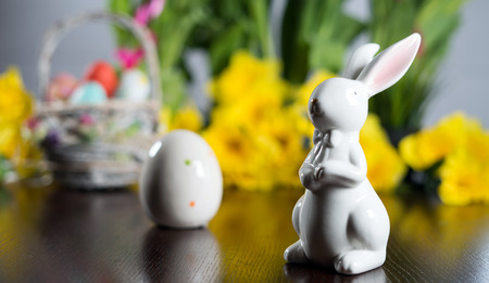Happy easter. Easter eggs and easter decoration on the wooden table.