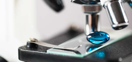 Laboratory Microscope. Scientific and healthcare research background .. drug tests tubes