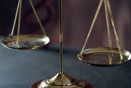 Law theme, mallet of the judge, wooden desk,