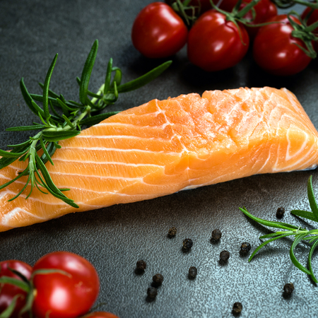 Fresh salmon on the cutting board.の写真素材