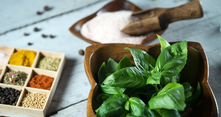 A collection of fresh spices on a gray stone tableの写真素材
