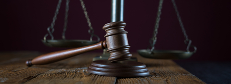 Judge's gavel in courtroom library. Law concept.の写真素材