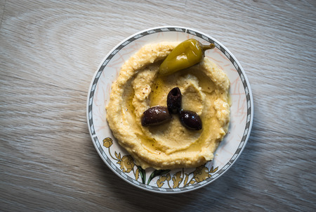 Hummus pasta and marinated chili peppersの写真素材