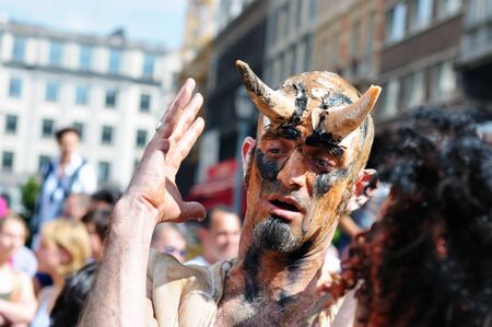 BRUSSELS, BELGIUM-MAY 19: Un unknown participant plays his role of a devil during Zinneke Parade on May 19, 2012 in Brussels. This parade is a biennial urban artistic and free-attendance event. のeditorial素材
