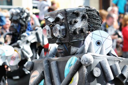 BRUSSELS, BELGIUM-MAY 19: An unknown participant demonstrates his fancy dress of robot during Zinneke Parade on May 19, 2012 in Brussels. This parade is a biennial urban artistic and free-attendance event with theme for year 2012 Disorder or Chaosのeditorial素材