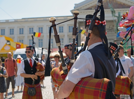 BRUSSELS, BELGIUM - JULY, 21: Unidentified performers in Scottish costumes participate in celebrations on street during National Day of Belgium on July 21, 2013 in Brusselsのeditorial素材
