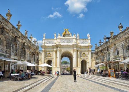 NANCY, FRANCE - JULY, 7: Tourists arrive to Triumphal Arch and Place Stanislas in historical center of Nancy on July 7, 2013 in Nancy.This square is in World Heritage Sites list of UNESCO since 1983のeditorial素材