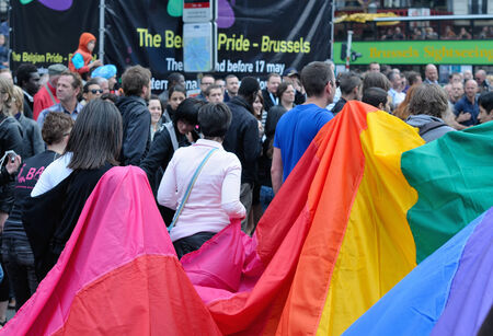 BRUSSELS, BELGIUM-MAY 15, 2010: Activists of Gay Pride Parade participate in annual defile with rainbow flagのeditorial素材
