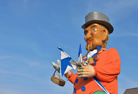 HALLE, BELGIUM-MARCH 29, 2014: Giant figure of a traditional businessman demonstrated in defile during yearly Halle Carnival. のeditorial素材