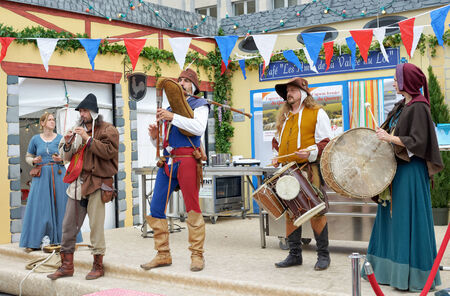 BRUSSELS, BELGIUM-SEPTEMBER 22, 2013: Medieval style French musical group participate in folkloric activities on Mont des Arts. France presented artisanal products and tourist attractions of valley Lot.のeditorial素材