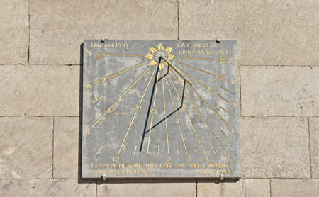 LIEGE, BELGIUM-OCTOBER 19, 2014: Sundial on the wall of church of Saint Nicolas by J.Bossart...