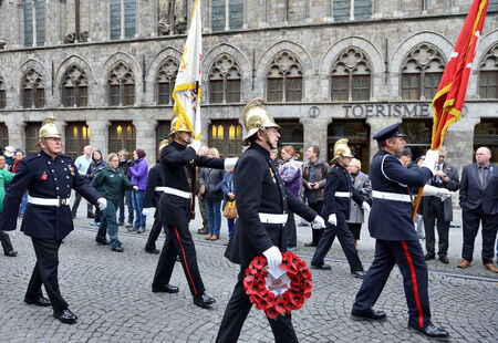 YPRES, BELGIUM-NOVEMBER 11, 2014: Participants of Poppy Parade commemorating 100 years of World War I depart from Grand Place to Porte de Menin or Gates of Meninのeditorial素材