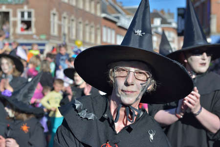 NIVELLES, BELGIUM-MARCH 03, 2014: Group in costumes of witches participates in defile during yearly carnival in Nivellesのeditorial素材