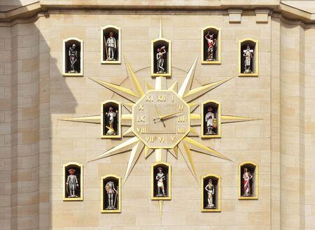 BRUSSELS, BELGIUM-MARCH 06, 2015: Giant wall clock with statues above of the carillon on the wall of Palace of Dynastyのeditorial素材