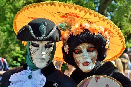 MOUSCRON, BELGIUM-JUNE 06, 2015: Participant of Venice in Mouscron promenade in Parc Communal demonstrates costume of venetian carnivalのeditorial素材