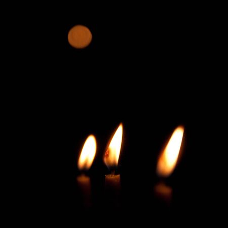 Three candles and  their lightの写真素材