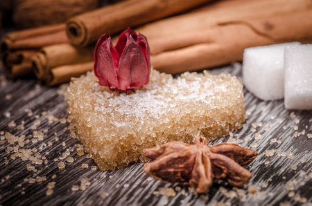 Heart shaped brown sugar and star anise  on wooden surface                                   
の写真素材
