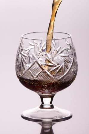Pouring brandy in a crystal glass
の写真素材