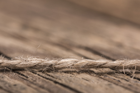 Hemp rope against a wooden backgroundの写真素材