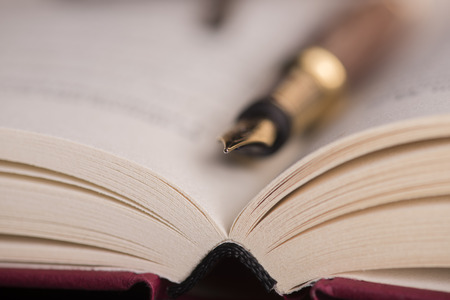 Open book and fountain penの写真素材