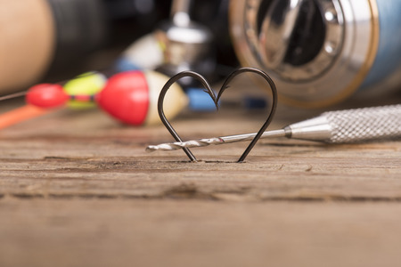 Heart shaped fishing hooks and fishing toolsの写真素材