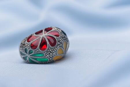 Colorful silver  ring  jewel on textile surfaceの写真素材
