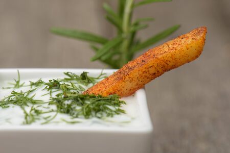 One fried potato soaked ?n a garlic sauce